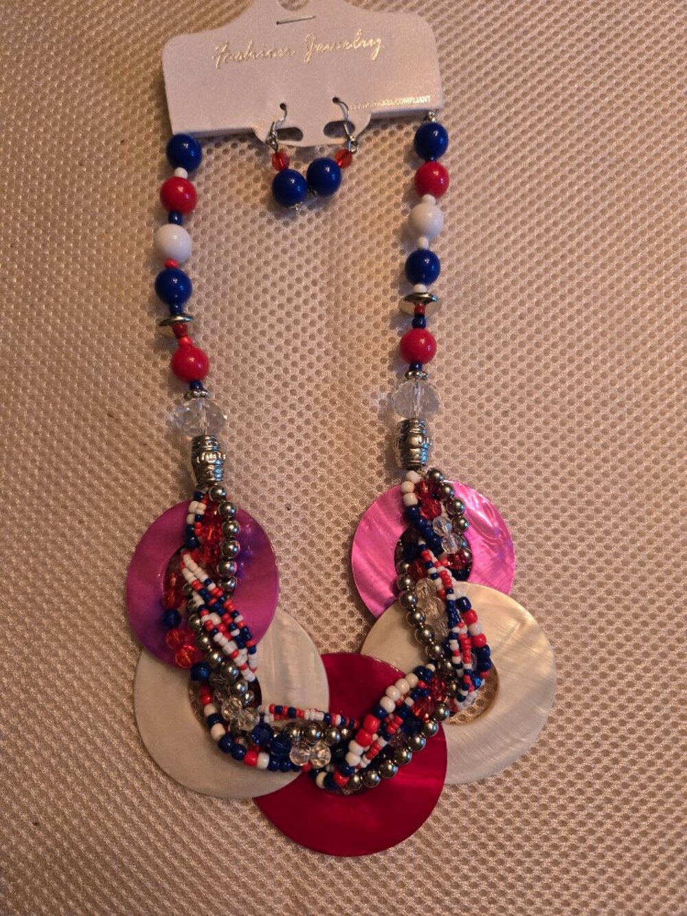 Acrylic necklace in hues of purple, red, white, & blue. Cute pop for summer